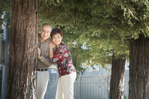 Hispanic couple smiling outdoors