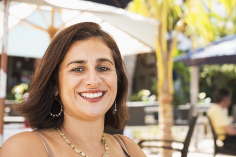 Hispanic woman smiling outdoors