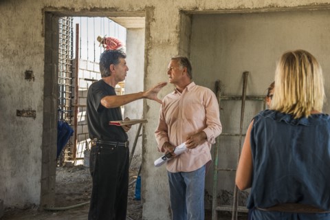 Architects talking at construction site