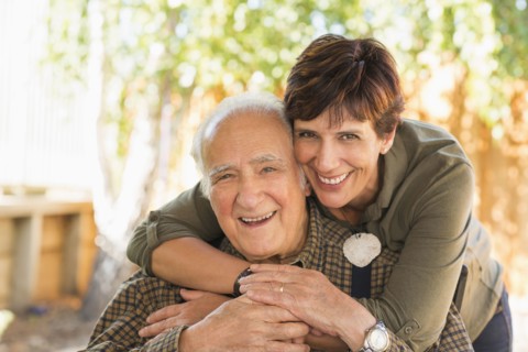 Hispanic father and daughter hugging