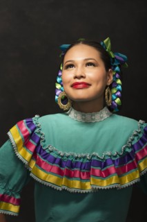 Hispanic teenage girl wearing Puebla Folkloric dress
