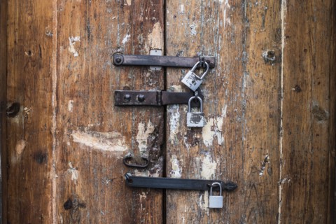 Close up of padlocks on secure door
