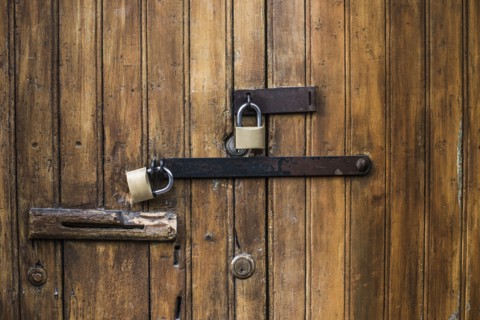 Close up of padlocks on secure door