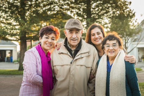 Hispanic Multi-generation family smiling outdoors