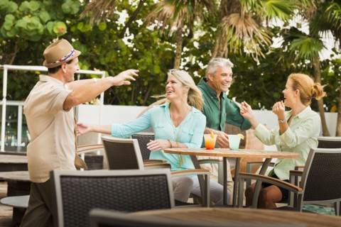 Couples hugging on restaurant patio