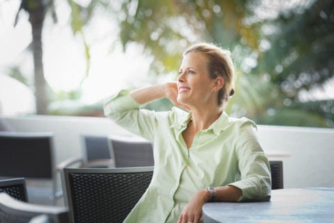 Woman sitting at patio bar