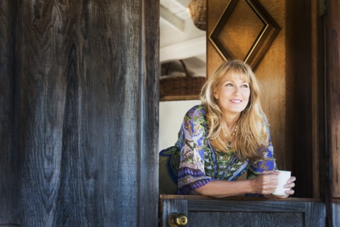Caucasian woman smiling in doorway