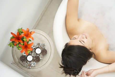 Woman relaxing in bubble bath