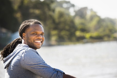 African American man smiling outdoors