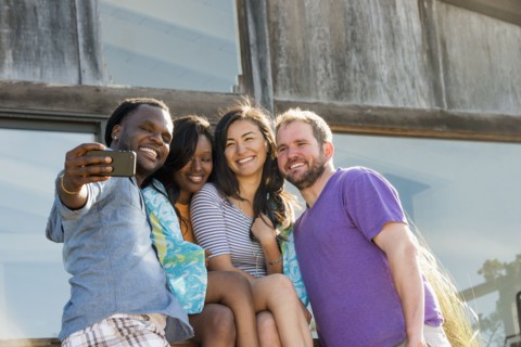 Friends taking selfie outdoors