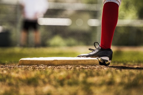 Baseball player touching base