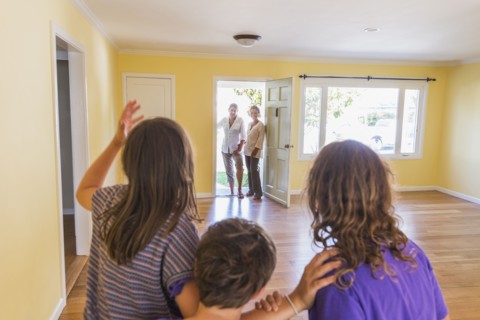 Family admiring new home
