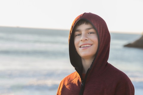 Mixed race boy smiling outdoors