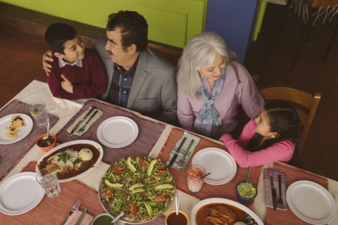High angle view of grandparents and grandchildren in restaurant