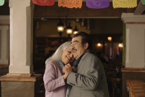 Older couple dancing in restaurant