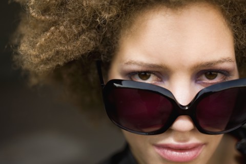Close up of mixed race woman wearing sunglasses