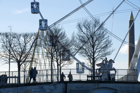People walking near ferris wheel in Paris
