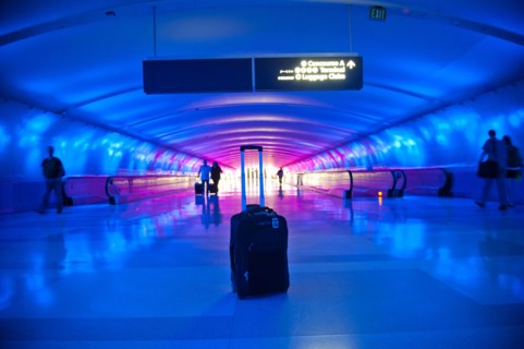 Abandoned suitcase in blue airport terminal