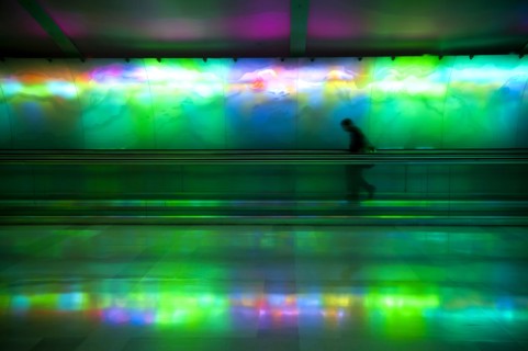 Silhouette of person on moving walkway