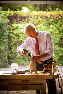 Man building birdhouse in garage