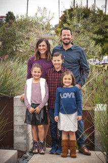 Portrait of smiling family in garden
