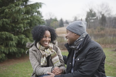 Couple sitting together in park