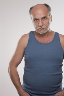 Serious Caucasian man in muscle-t
