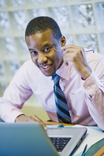 African American businessman sitting at desk