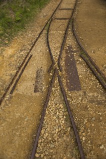 High angle view of train tracks in sand