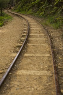 High angle view of train tracks in sand