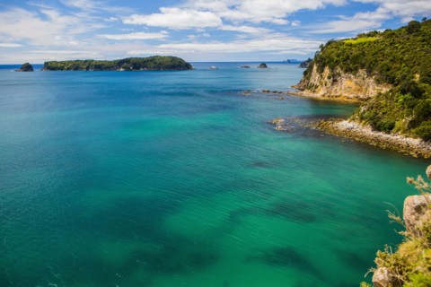 High angle view of remote cove and ocean horizon