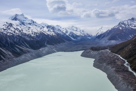 Remote mountains over frozen lake