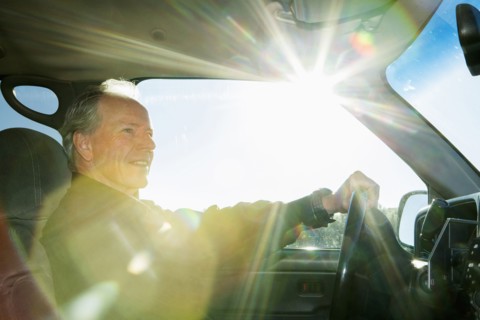 Caucasian man driving car