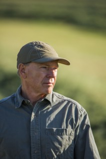 Caucasian farmer standing in field
