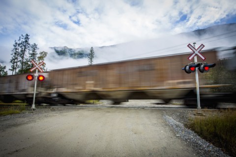 Train speeding through railroad crossing
