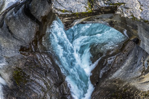Rapids flowing under rocks