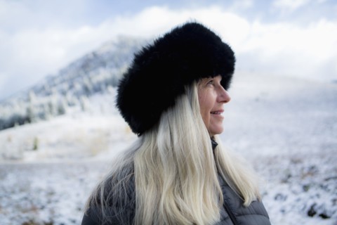 Caucasian woman wearing fur hat in winter