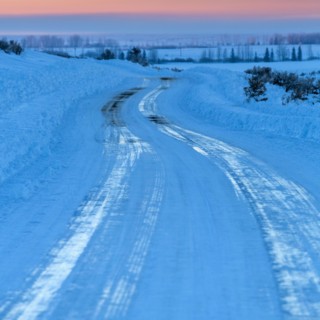 Ice on winding road in winter