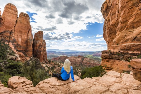 Caucasian woman admiring scenic view in desert landscape