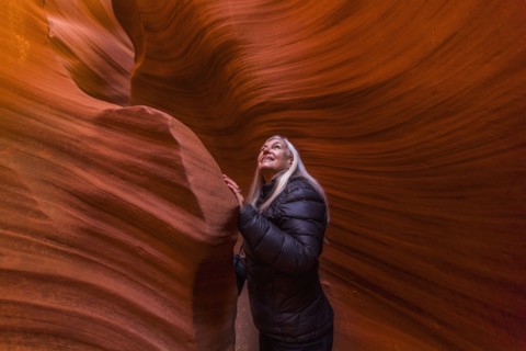 Caucasian woman standing in rock formation