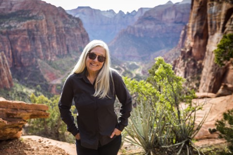 Caucasian woman posing near rock formations