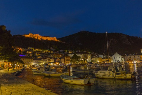 Scenic view of boats at waterfront at night
