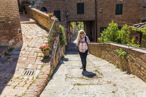 Caucasian woman hiking urban hill