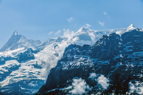 Clouds on snowy mountains