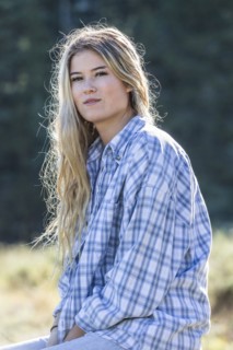 Portrait of smiling Caucasian girl wearing plaid shirt
