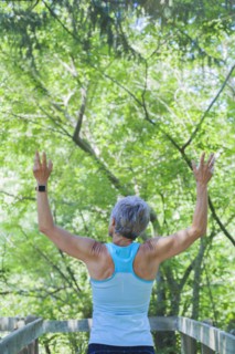 Smiling Caucasian woman celebrating outdoors