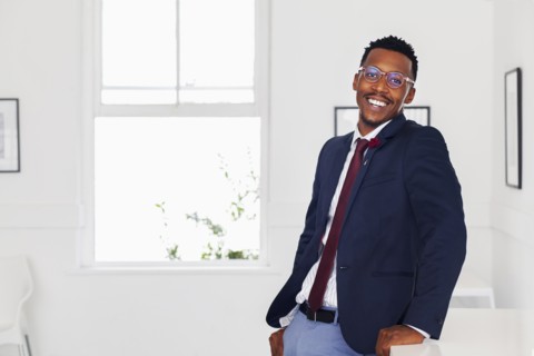 Black man smiling in gallery