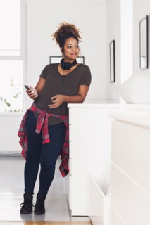 Mixed race woman holding cell phone