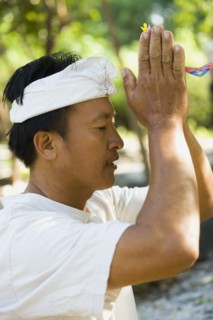 Asian man praying