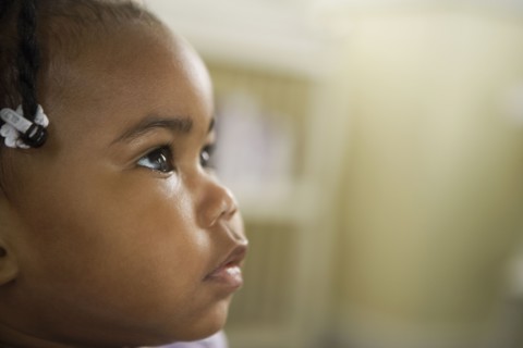 Curious African girl looking up